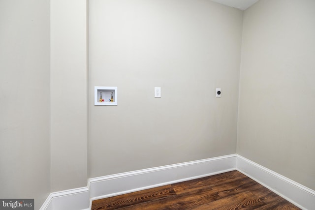 clothes washing area with laundry area, baseboards, dark wood-style floors, hookup for a washing machine, and electric dryer hookup