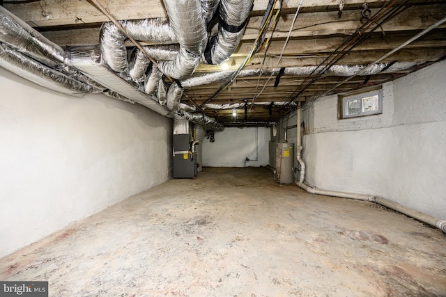 basement with gas water heater and heating unit