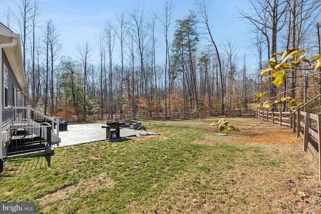 view of yard featuring a patio area and a fenced backyard