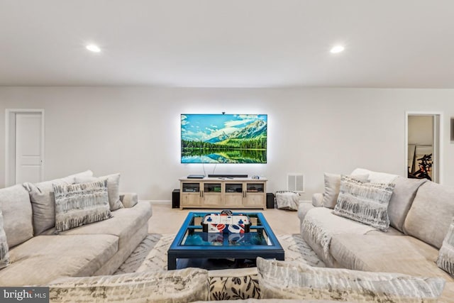 carpeted living room featuring baseboards, visible vents, and recessed lighting