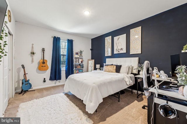 carpeted bedroom with baseboards