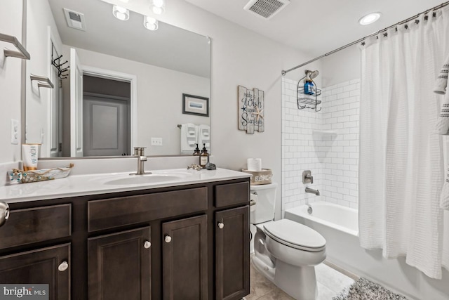 full bath featuring toilet, vanity, shower / bath combination with curtain, and visible vents