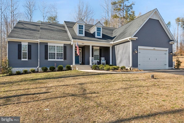 view of front of home with a garage, a front lawn, a porch, and concrete driveway