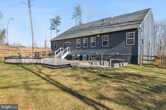 back of property featuring a patio area, fence, an outdoor hangout area, and a lawn