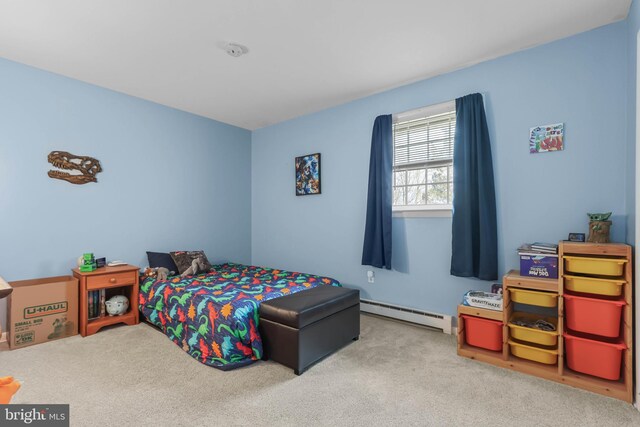 carpeted bedroom with baseboard heating