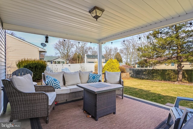 view of patio with outdoor lounge area and a fenced backyard