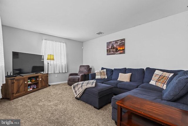 living room with baseboards, carpet floors, and visible vents