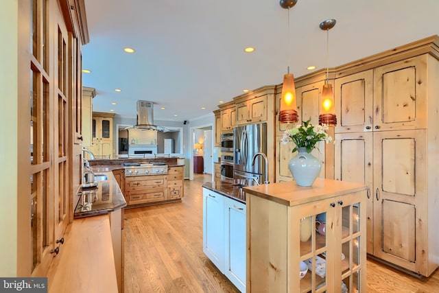 kitchen with light wood-style flooring, recessed lighting, appliances with stainless steel finishes, dark countertops, and island range hood