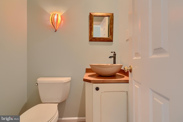 bathroom with toilet and vanity