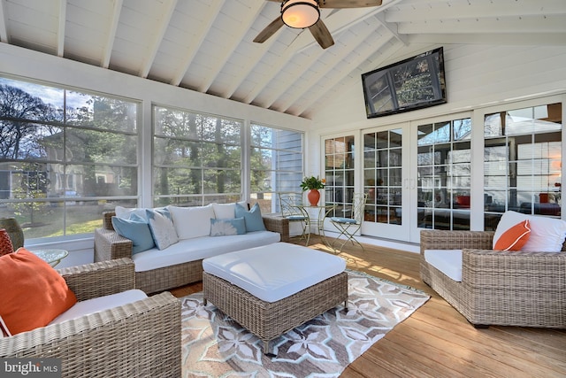 sunroom / solarium featuring lofted ceiling with beams and ceiling fan