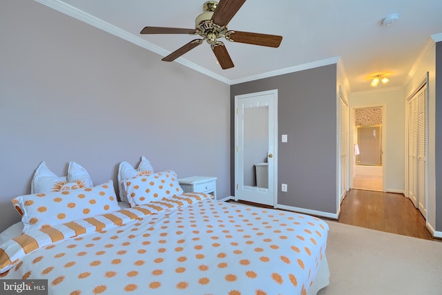 bedroom with ceiling fan, baseboards, and ornamental molding