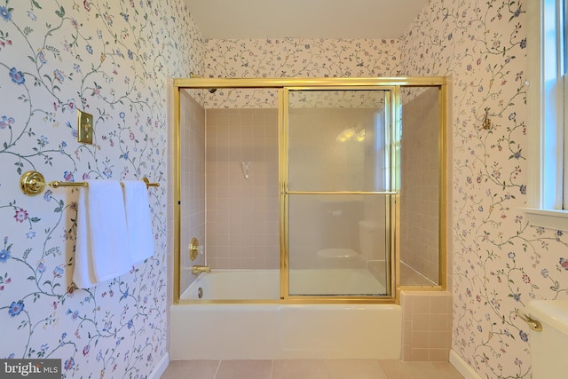 full bathroom with tile patterned floors, wallpapered walls, and enclosed tub / shower combo