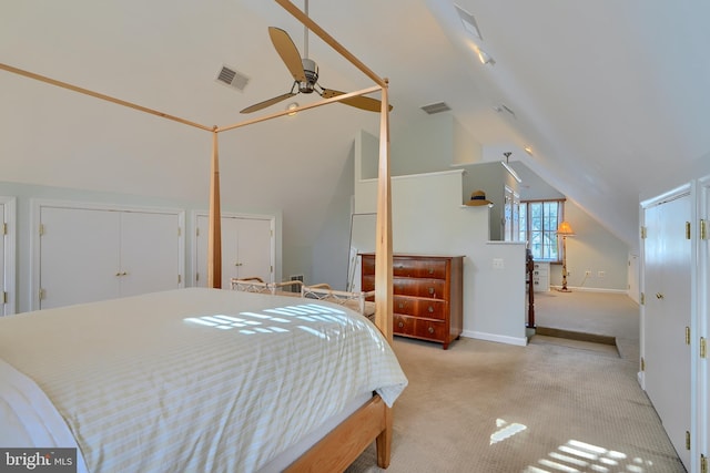 carpeted bedroom featuring visible vents, baseboards, a ceiling fan, and vaulted ceiling