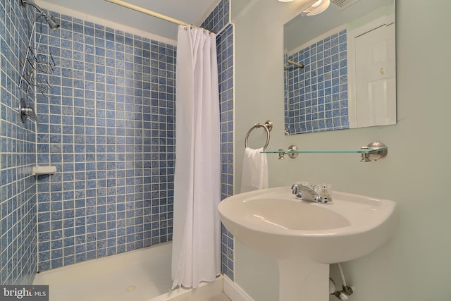 full bathroom with a stall shower