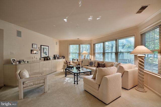 living room featuring light carpet, baseboards, visible vents, and ornamental molding