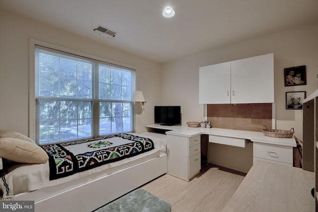 interior space featuring light wood-style flooring and visible vents