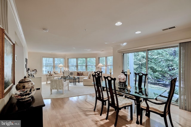 dining room with plenty of natural light, visible vents, light wood-style flooring, and recessed lighting