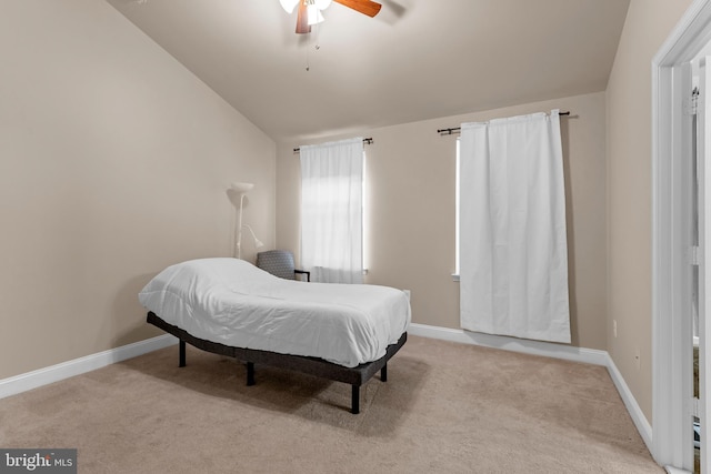 bedroom featuring carpet floors, lofted ceiling, ceiling fan, and baseboards