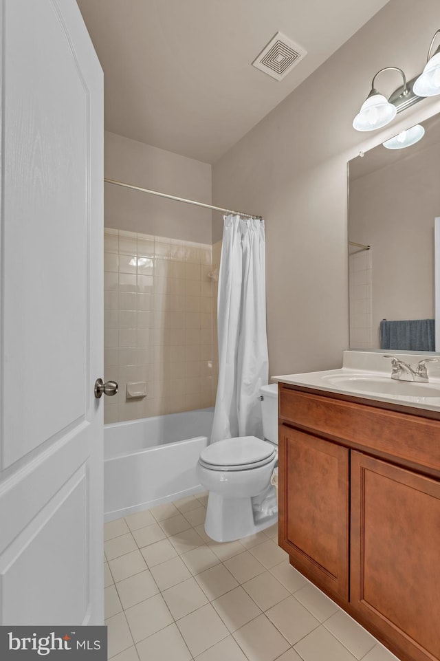 bathroom with toilet, shower / tub combo, vanity, visible vents, and tile patterned floors