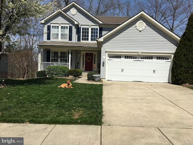 traditional-style house with a porch, concrete driveway, a front lawn, and a garage