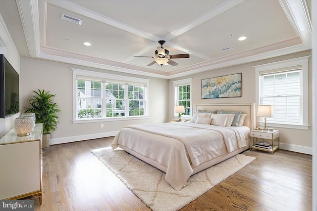 bedroom featuring wood finished floors, visible vents, coffered ceiling, and baseboards