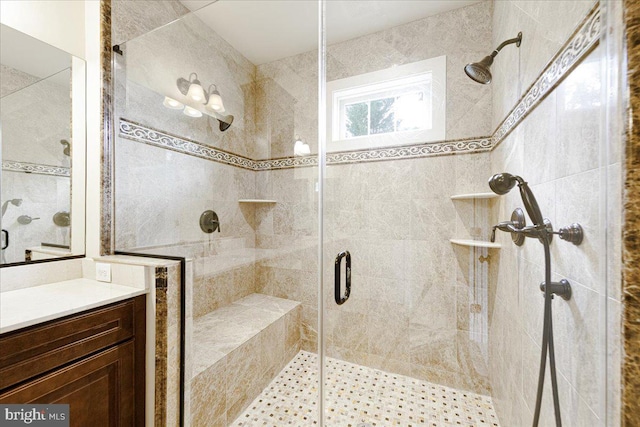 full bath featuring a stall shower and vanity