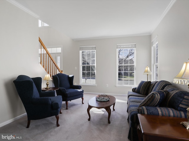 carpeted living room with stairway, baseboards, and ornamental molding