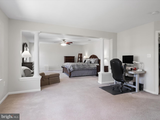 bedroom featuring decorative columns, baseboards, carpet, and a ceiling fan