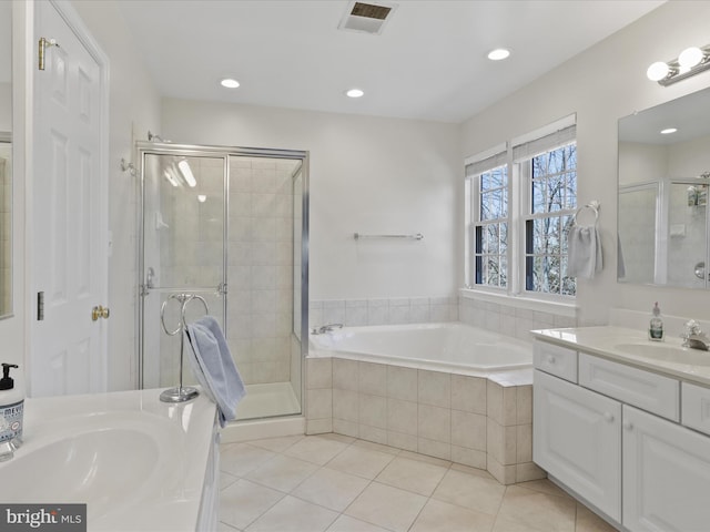 bathroom featuring visible vents, a garden tub, a stall shower, tile patterned flooring, and vanity