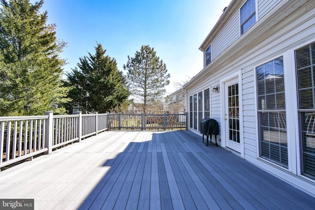 deck featuring a grill