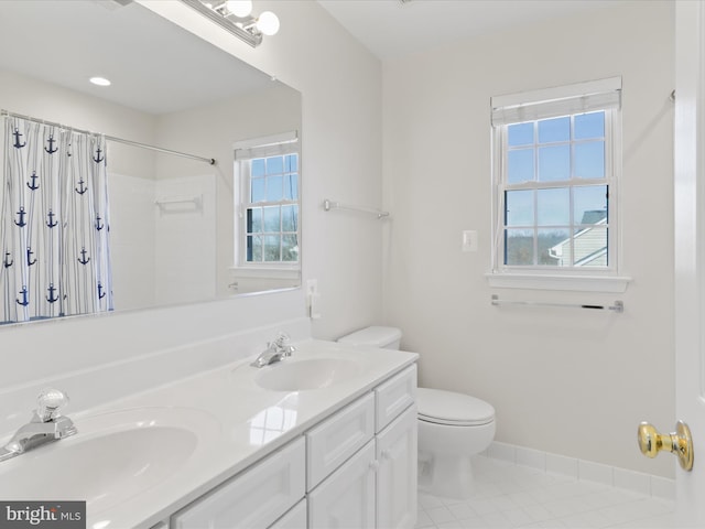 bathroom featuring tile patterned floors, toilet, a shower with curtain, and a sink