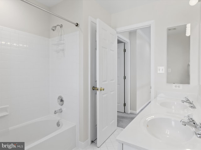 full bath featuring a sink, bathing tub / shower combination, double vanity, and tile patterned floors