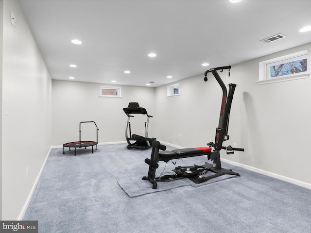 exercise room with recessed lighting, visible vents, carpet floors, and baseboards