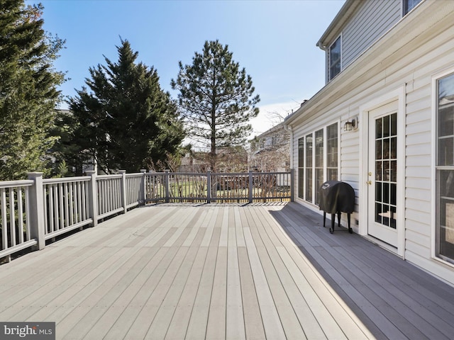 wooden deck featuring grilling area