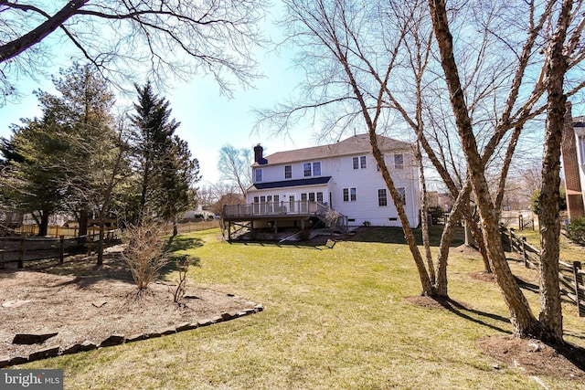 view of yard with a fenced backyard and a wooden deck