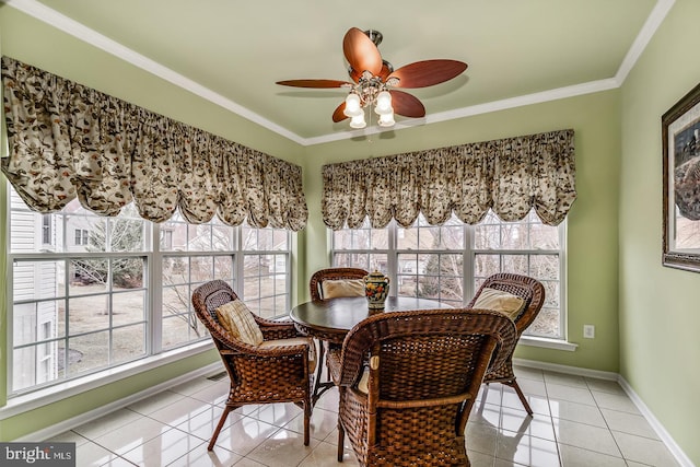 dining area featuring light tile patterned floors, baseboards, ornamental molding, and a ceiling fan