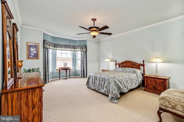 carpeted bedroom featuring baseboards, ornamental molding, and ceiling fan