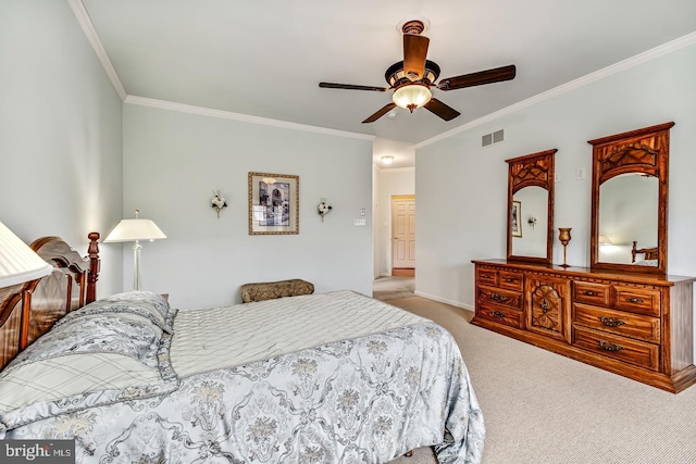 bedroom featuring ceiling fan, carpet floors, ornamental molding, and visible vents