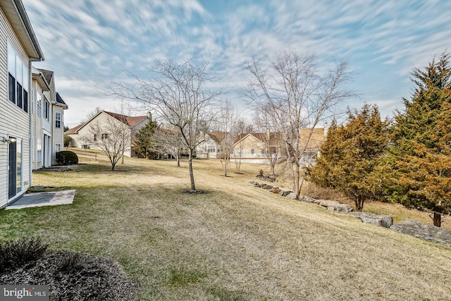 view of yard featuring a residential view