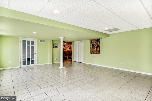 empty room featuring recessed lighting, decorative columns, visible vents, and baseboards