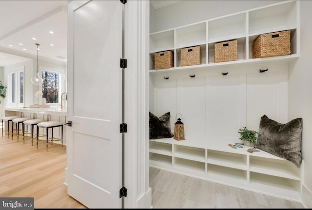 mudroom with light wood-style flooring and recessed lighting