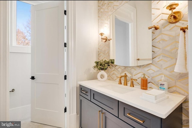 bathroom featuring backsplash and vanity