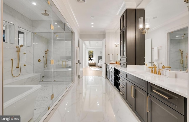 full bath with a soaking tub, ornamental molding, marble finish floor, vanity, and a shower stall