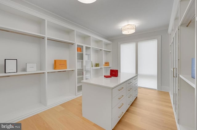 walk in closet featuring light wood finished floors