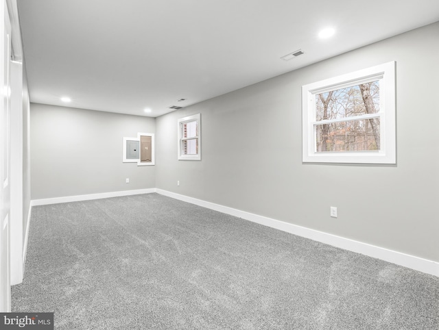 below grade area with recessed lighting, baseboards, visible vents, and carpet flooring