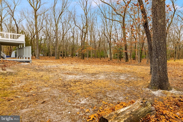 view of yard featuring a wooden deck