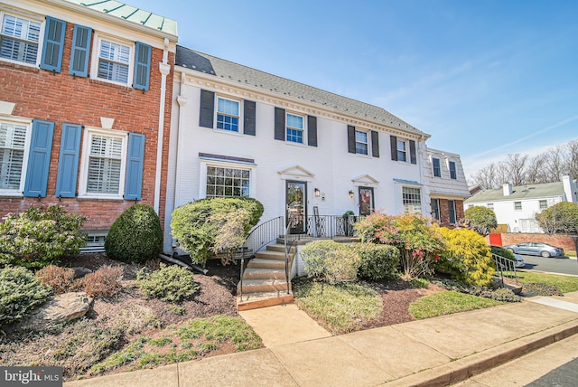 view of front of property featuring brick siding