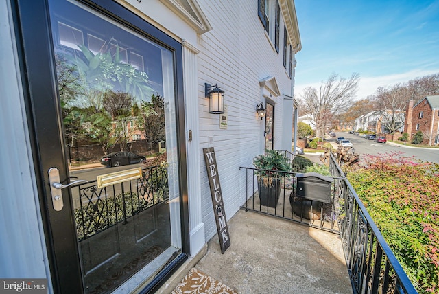 entrance to property featuring covered porch