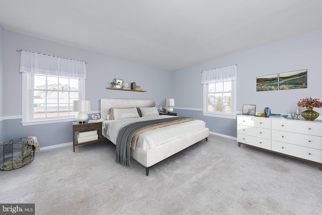 bedroom featuring baseboards and carpet floors