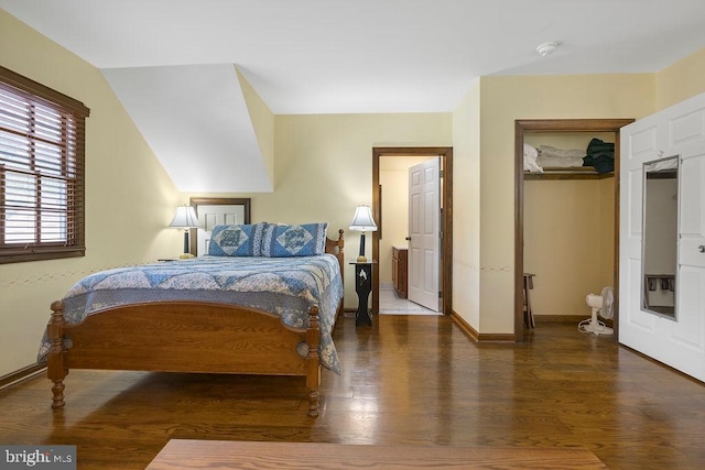 bedroom featuring baseboards and wood finished floors